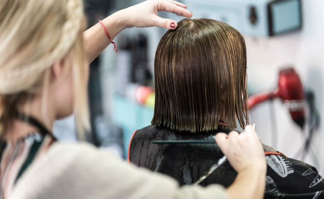 Woman getting her hair done at a hair salon